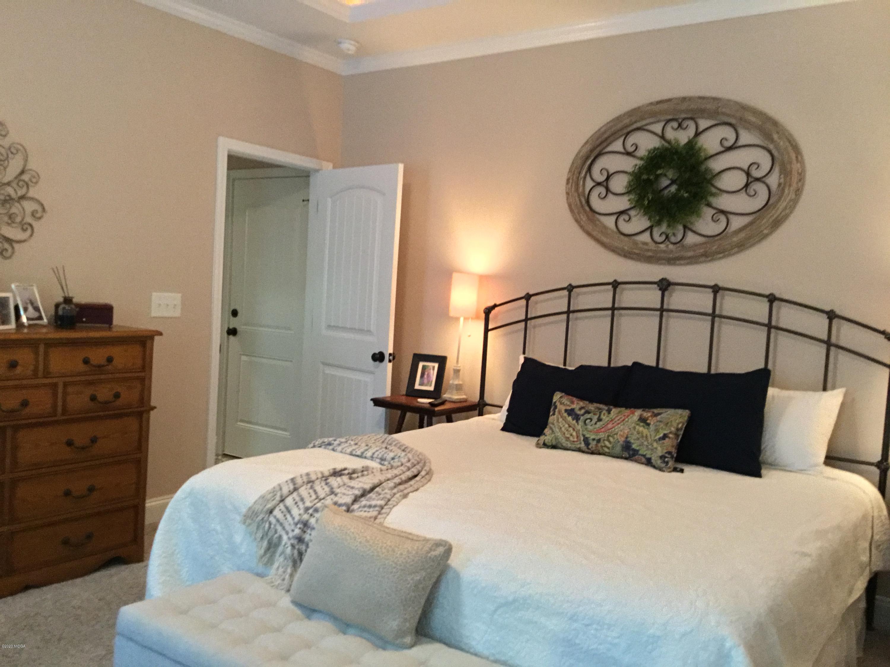 324 Walnut Grove Road Gray, GA 31032 - Photo 13 of 37 a bedroom with a bed and ceiling fan