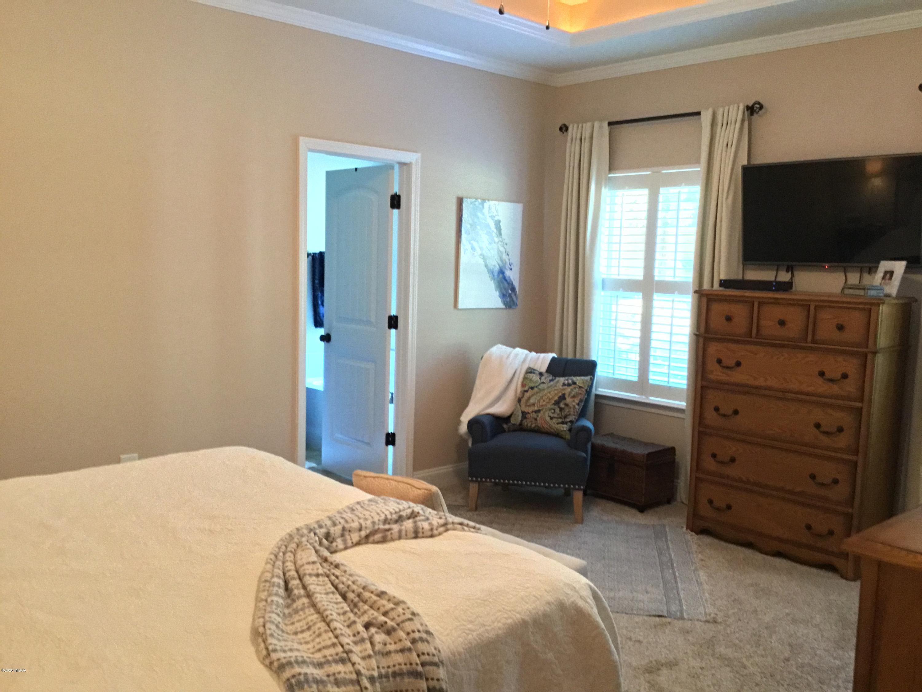 324 Walnut Grove Road Gray, GA 31032 - Photo 14 of 37 a bedroom with a bed and flat screen tv