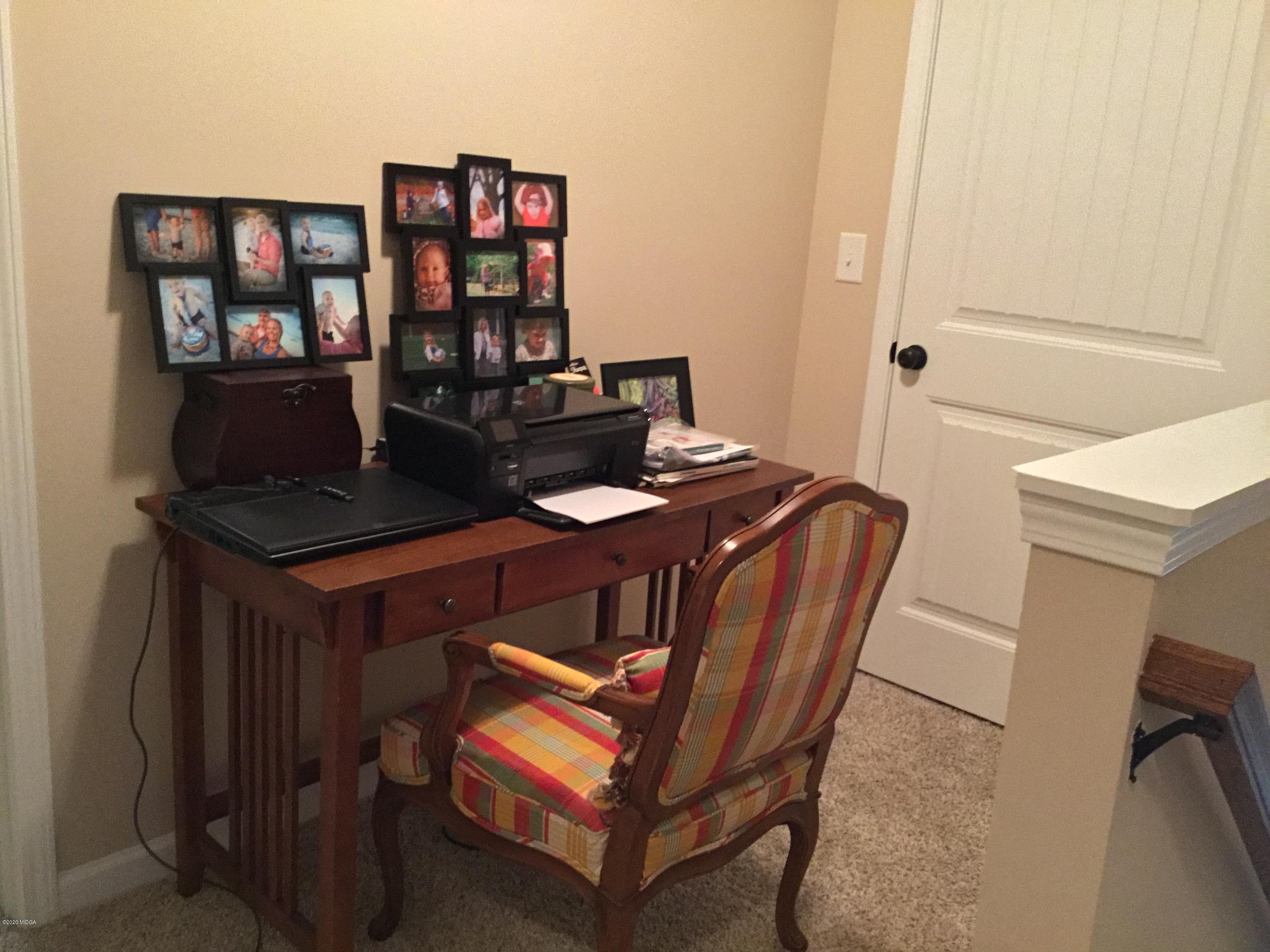 324 Walnut Grove Road Gray, GA 31032 - Photo 20 of 37 a table and chairs in a room