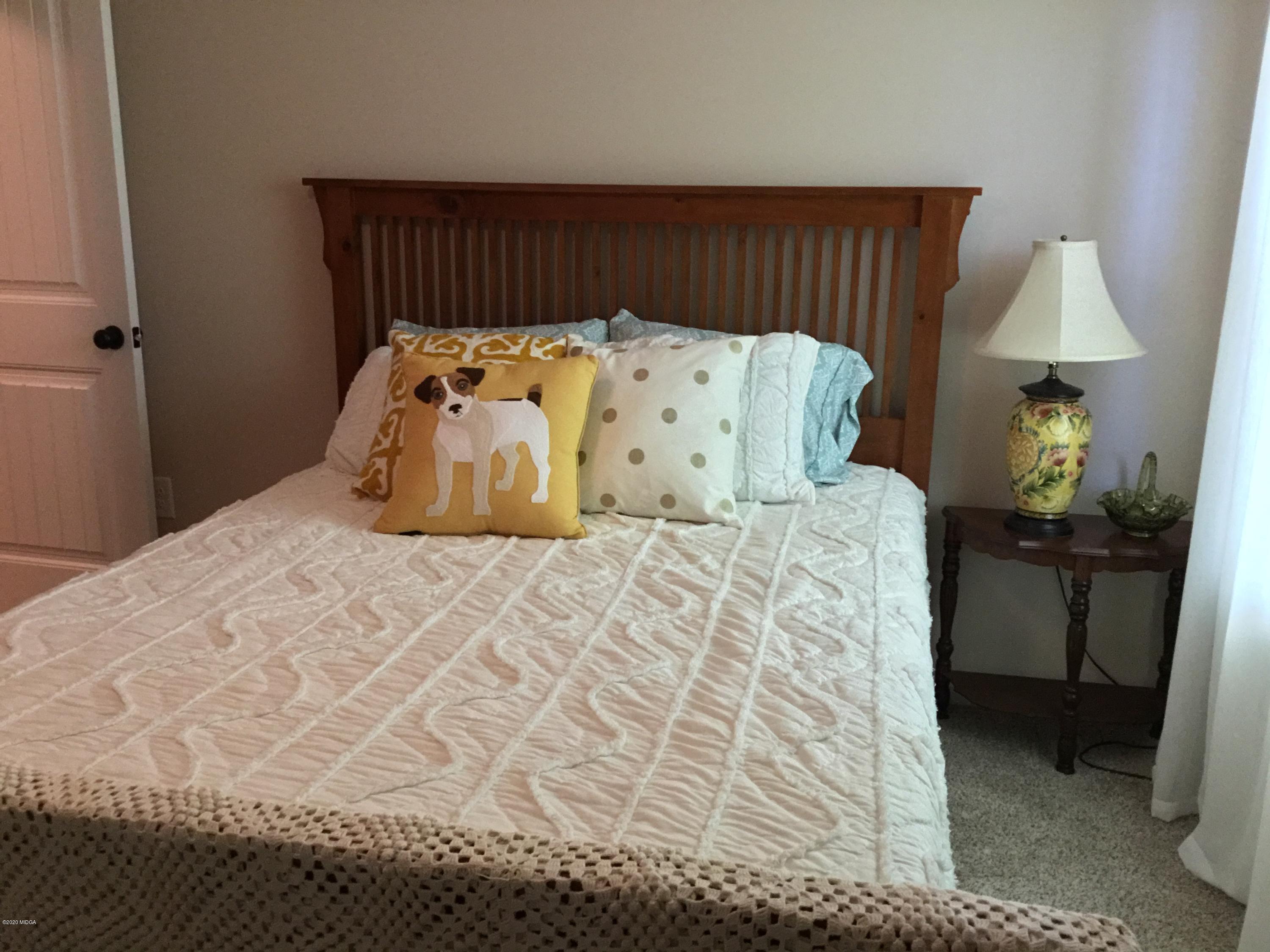 324 Walnut Grove Road Gray, GA 31032 - Photo 22 of 37 a bedroom with a bed and a lamp on dresser