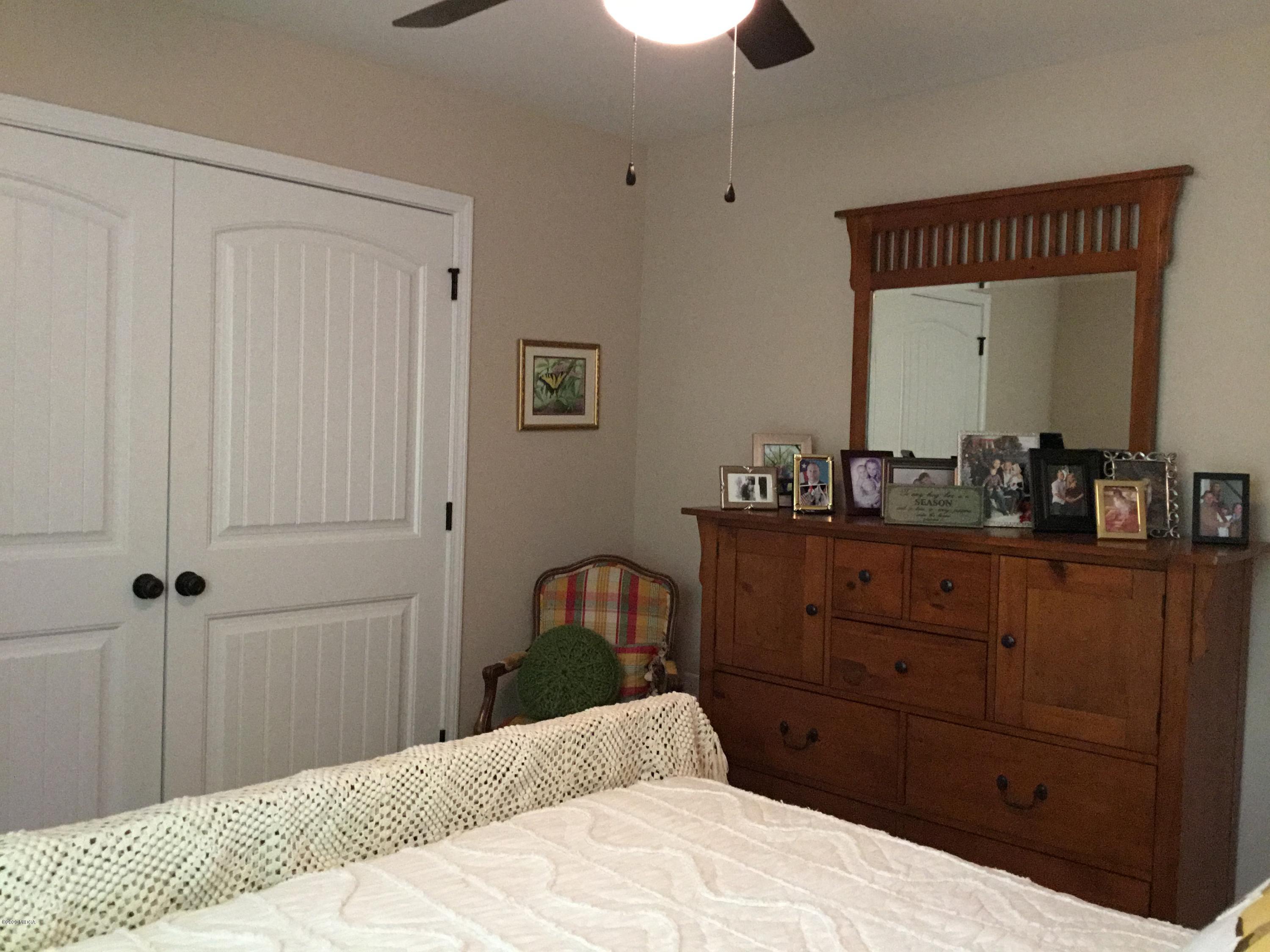 324 Walnut Grove Road Gray, GA 31032 - Photo 23 of 37 a bedroom with a bed and a dresser