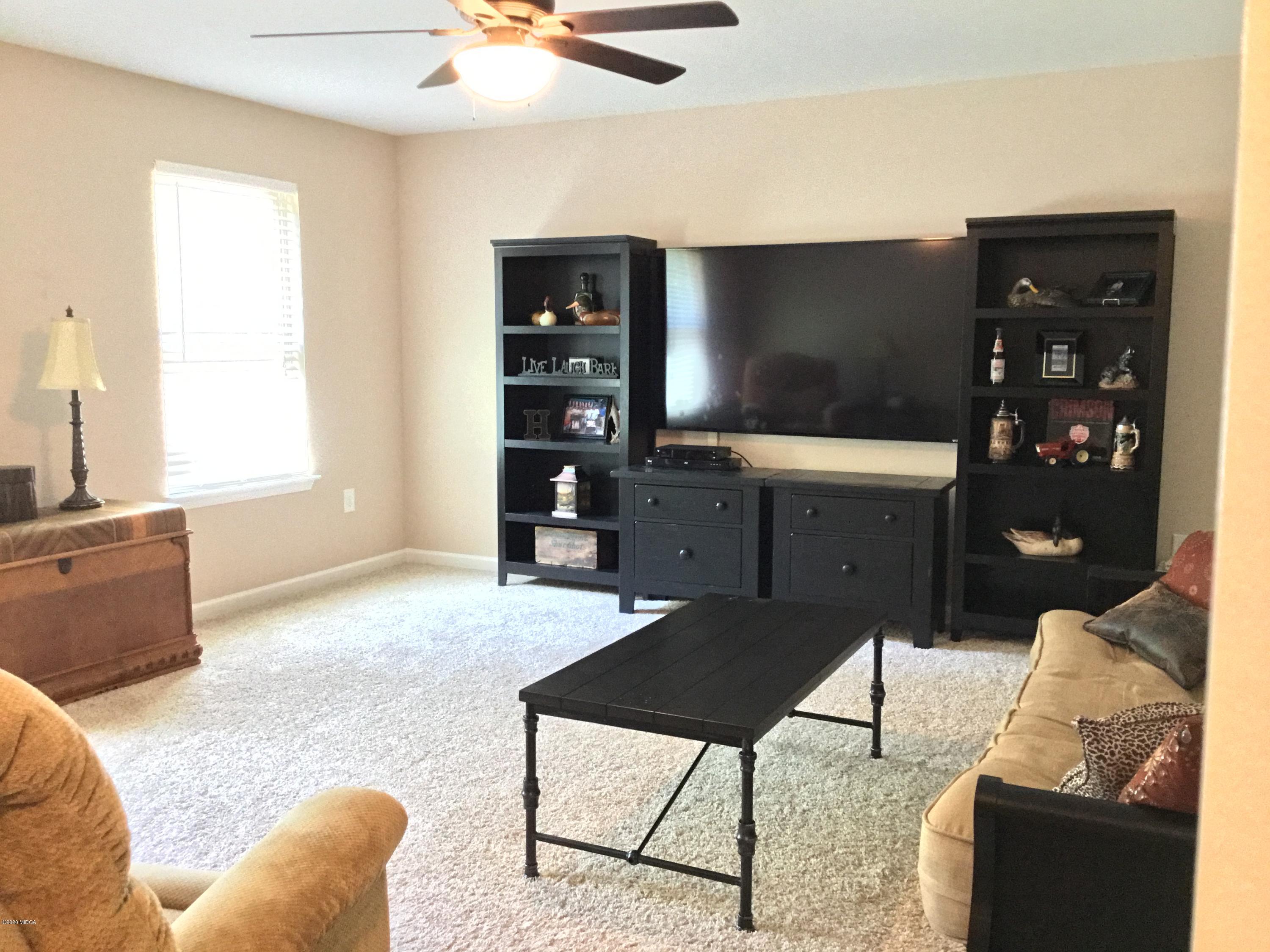 324 Walnut Grove Road Gray, GA 31032 - Photo 26 of 37 a living room with furniture and a flat screen tv