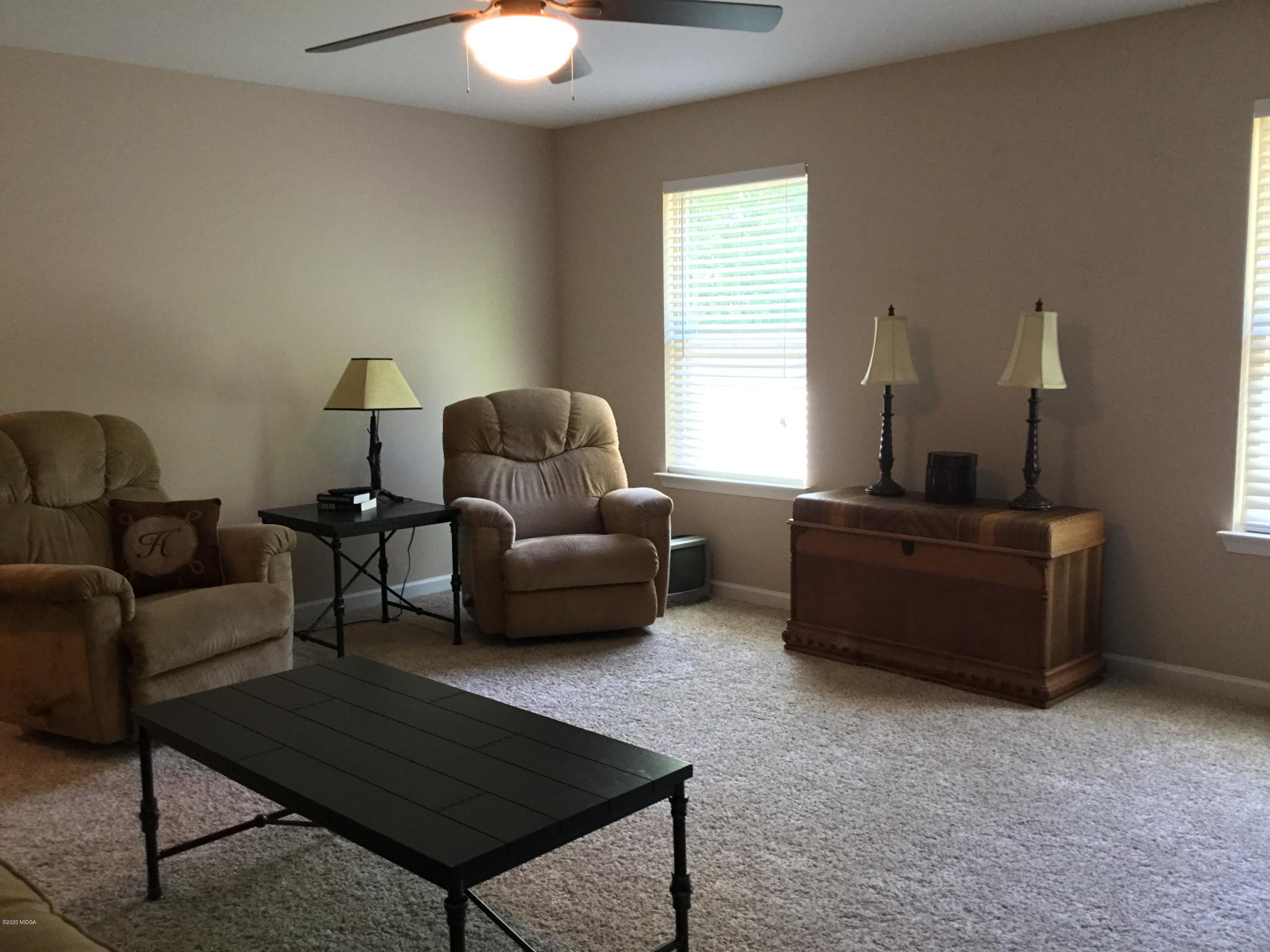 324 Walnut Grove Road Gray, GA 31032 - Photo 27 of 37 a living room with furniture and a window