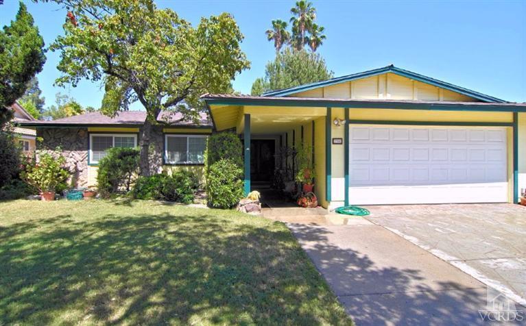 256 Kanan Road Oak Park, CA 91377 - Photo 2 of 26 a front view of a house with a yard and potted plants