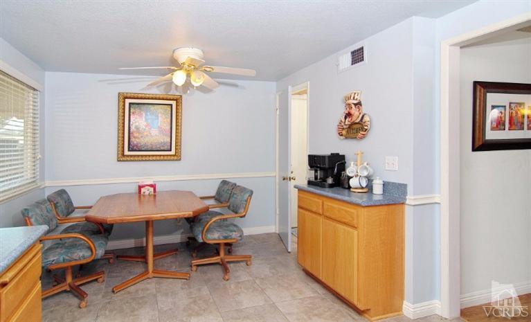 256 Kanan Road Oak Park, CA 91377 - Photo 13 of 26 a dining room with a table and chairs