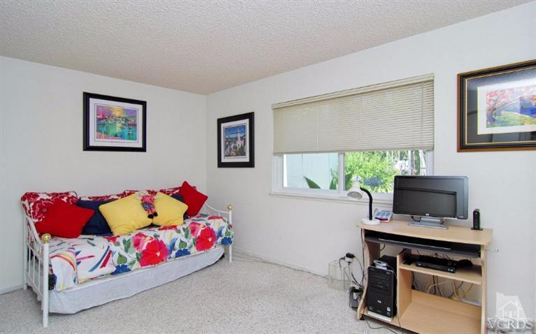 256 Kanan Road Oak Park, CA 91377 - Photo 20 of 26 a bedroom with furniture and a window