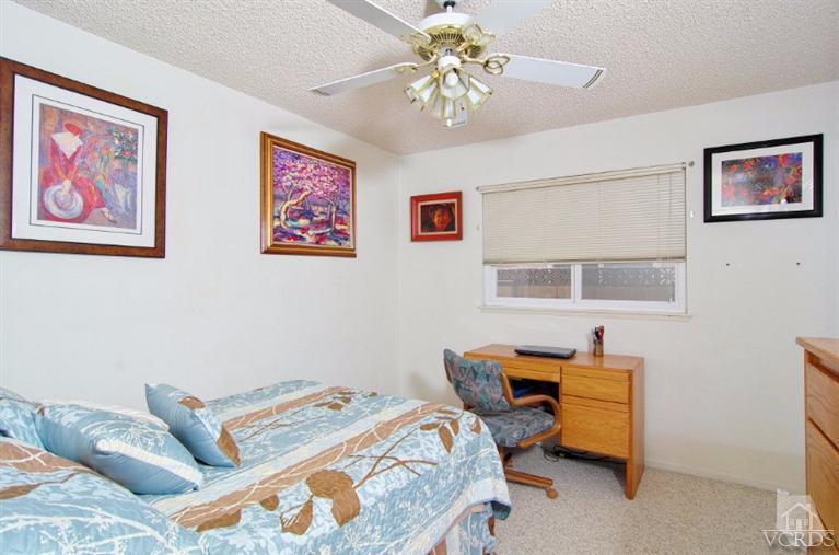 256 Kanan Road Oak Park, CA 91377 - Photo 21 of 26 a bedroom with bed and a window
