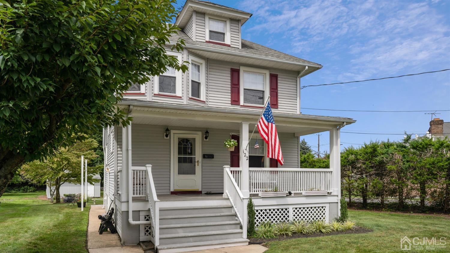 122 New Market Road Dunellen, NJ 08812 - Photo 2 of 28 front view of a house with a yard