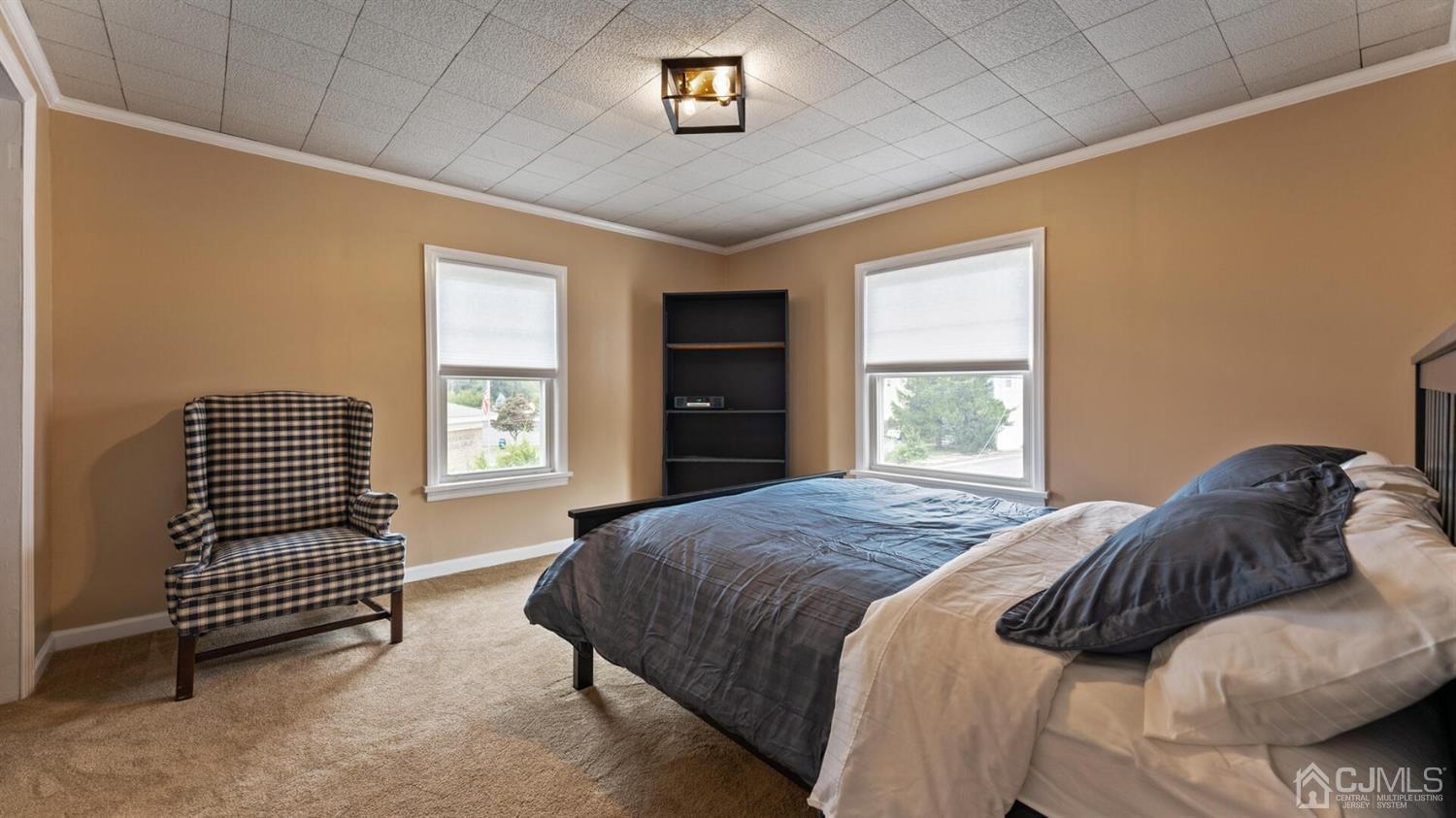 122 New Market Road Dunellen, NJ 08812 - Photo 16 of 28 a bedroom with a bed and a window