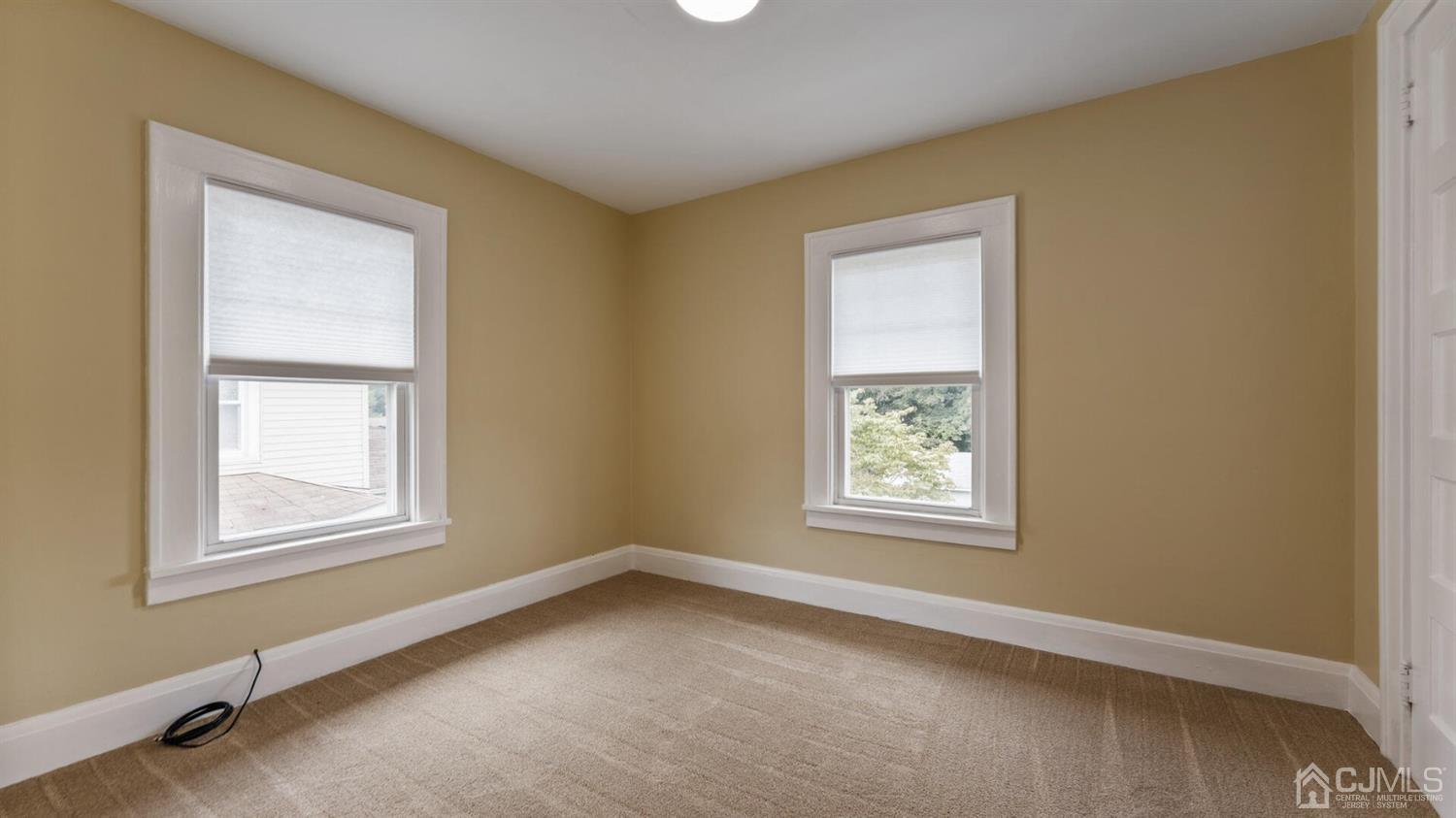 122 New Market Road Dunellen, NJ 08812 - Photo 17 of 28 an empty room with windows
