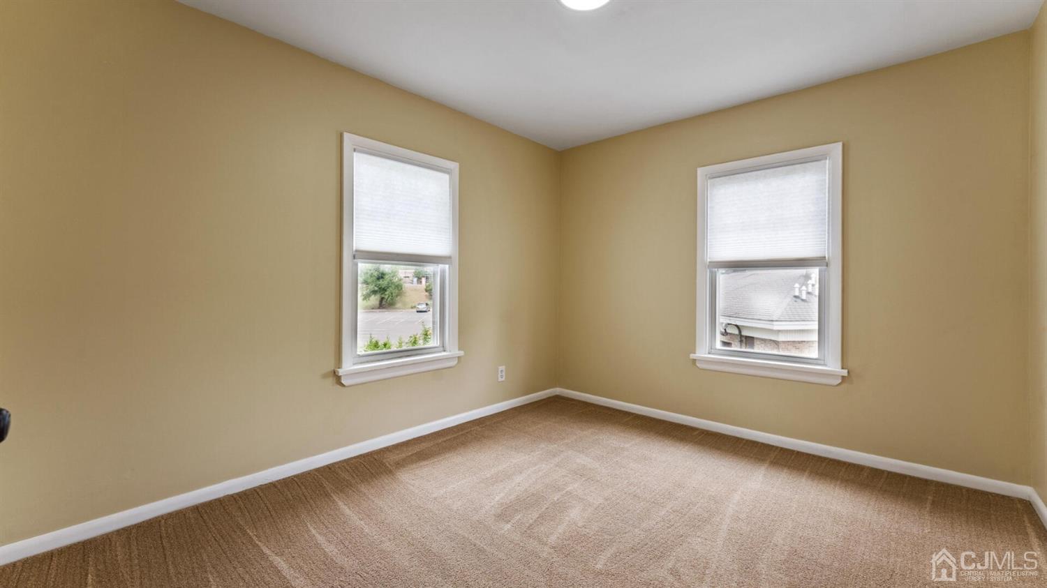 122 New Market Road Dunellen, NJ 08812 - Photo 18 of 28 a view of an empty room with a window