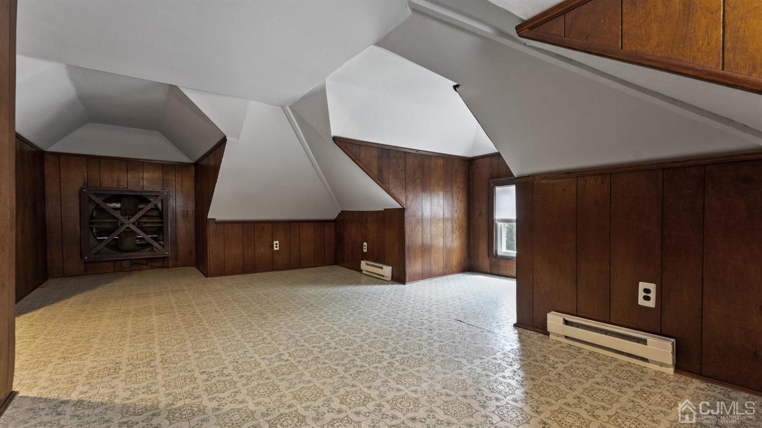 122 New Market Road Dunellen, NJ 08812 - Photo 21 of 28 a view of an empty room with a fireplace and a window