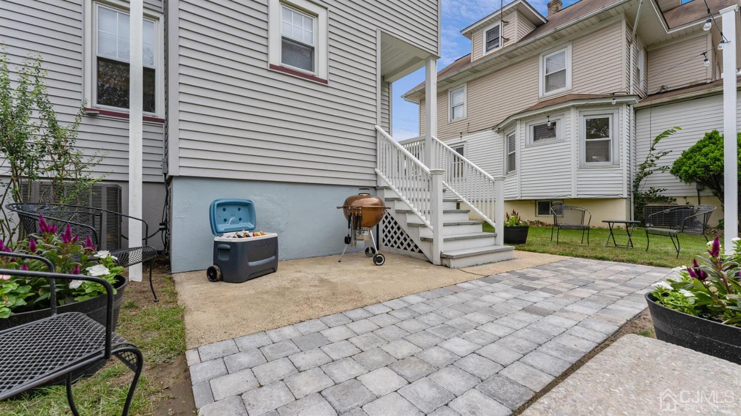 122 New Market Road Dunellen, NJ 08812 - Photo 24 of 28 a backyard of a house with seating space