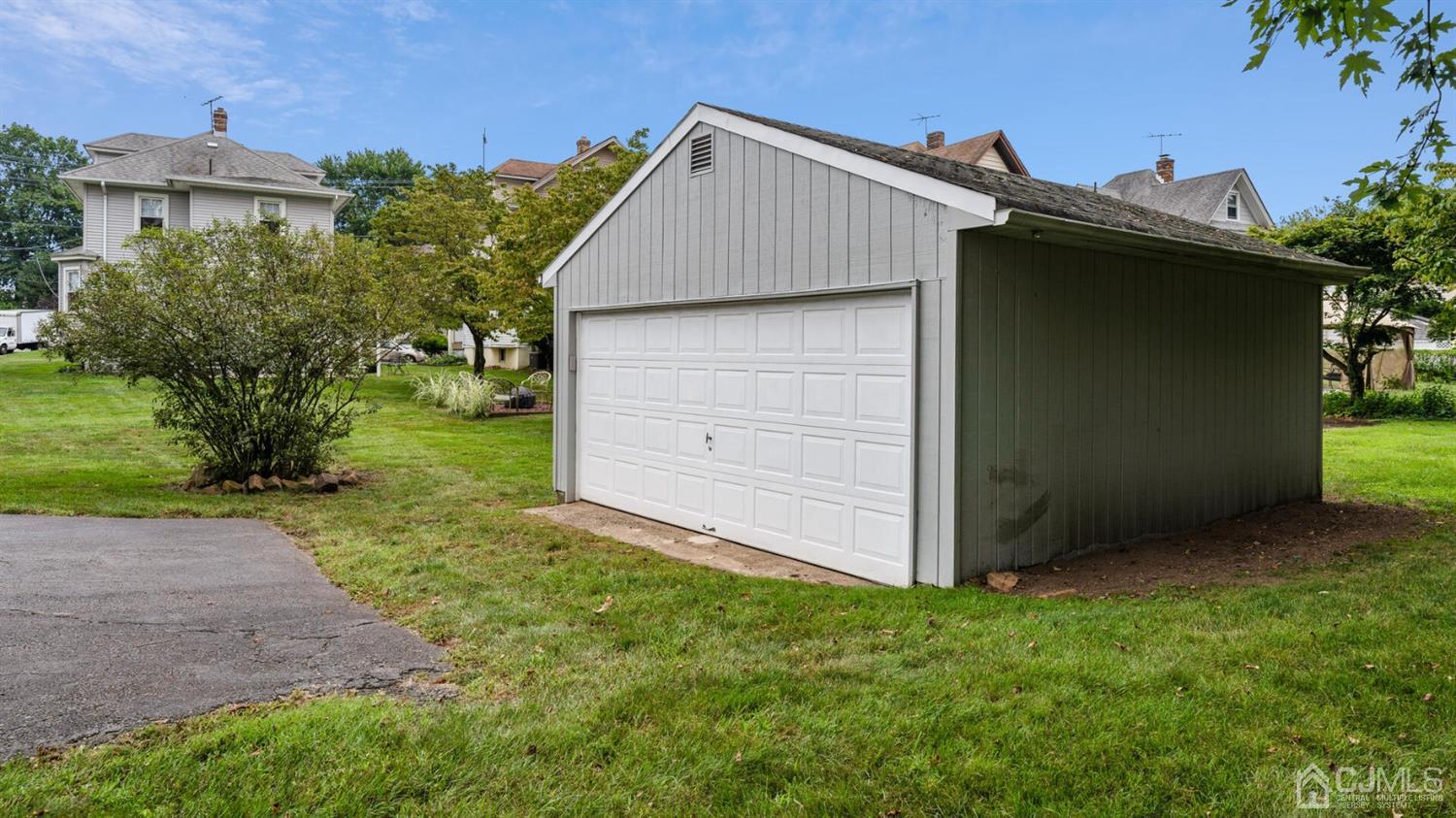 122 New Market Road Dunellen, NJ 08812 - Photo 27 of 28 a view of a house with a small yard and plants