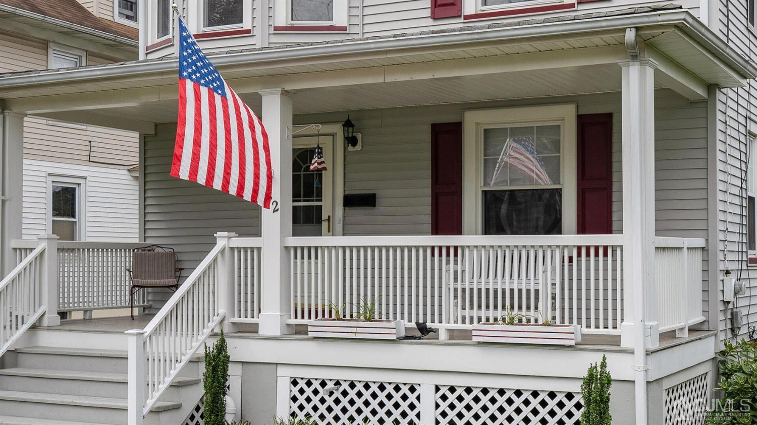 122 New Market Road Dunellen, NJ 08812 - Photo 4 of 28 a view of a house with wooden fence