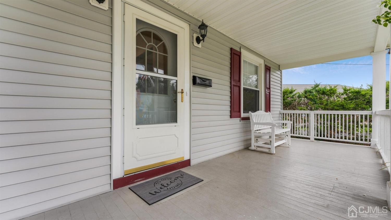 122 New Market Road Dunellen, NJ 08812 - Photo 5 of 28 a view of backyard with a large window and wooden fence