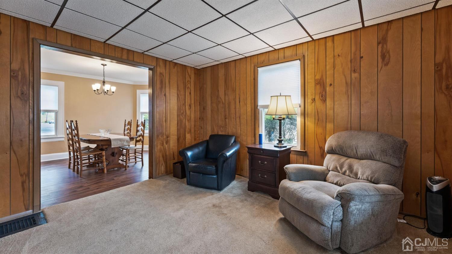 122 New Market Road Dunellen, NJ 08812 - Photo 8 of 28 a living room with furniture and a large window