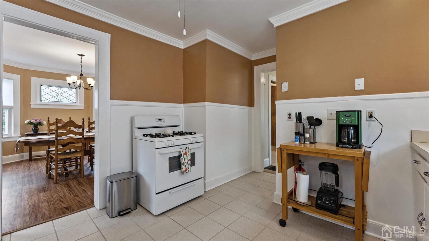 122 New Market Road Dunellen, NJ 08812 - Photo 10 of 28 a kitchen with a stove and a refrigerator
