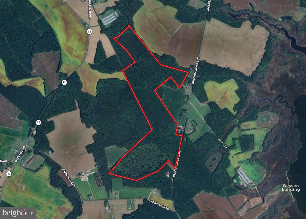 an aerial view of a house a yard and a wooden floor