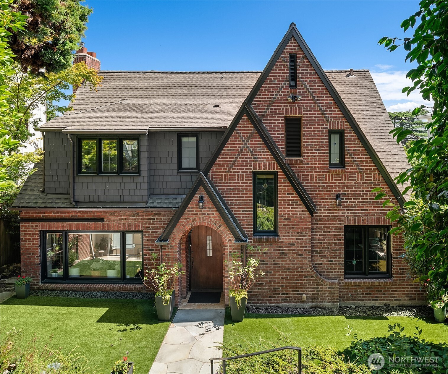 3220 Sierra Drive South Seattle, WA 98144 - Photo 1 of 39 a front view of a house with garden