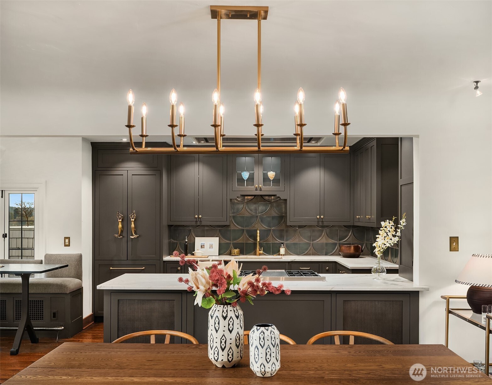 3220 Sierra Drive South Seattle, WA 98144 - Photo 12 of 39 a kitchen with kitchen island a sink stove and cabinets