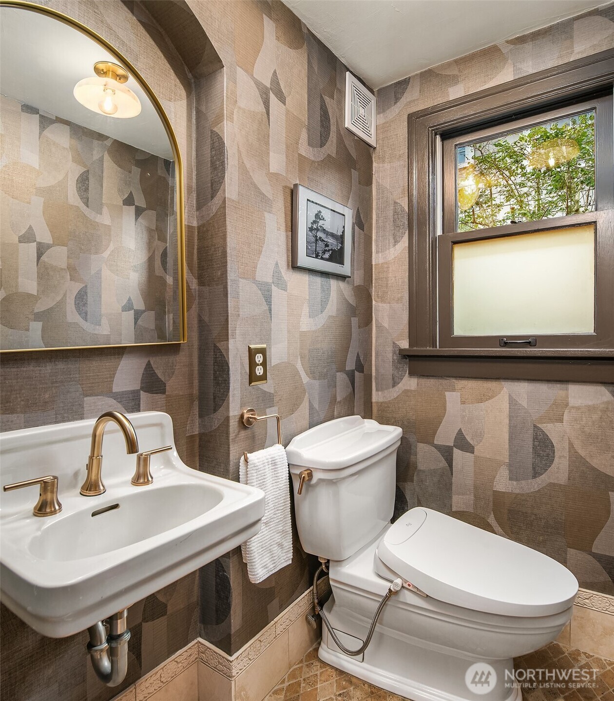 3220 Sierra Drive South Seattle, WA 98144 - Photo 17 of 39 a bathroom with a toilet sink and mirror