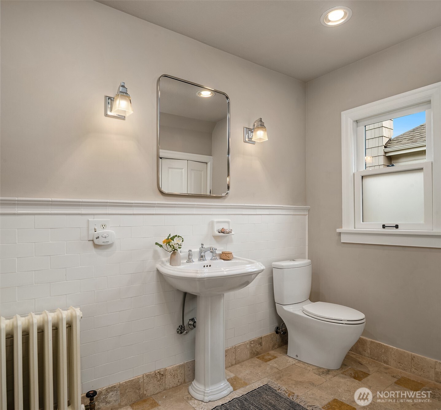 3220 Sierra Drive South Seattle, WA 98144 - Photo 26 of 39 a bathroom with a toilet sink and mirror