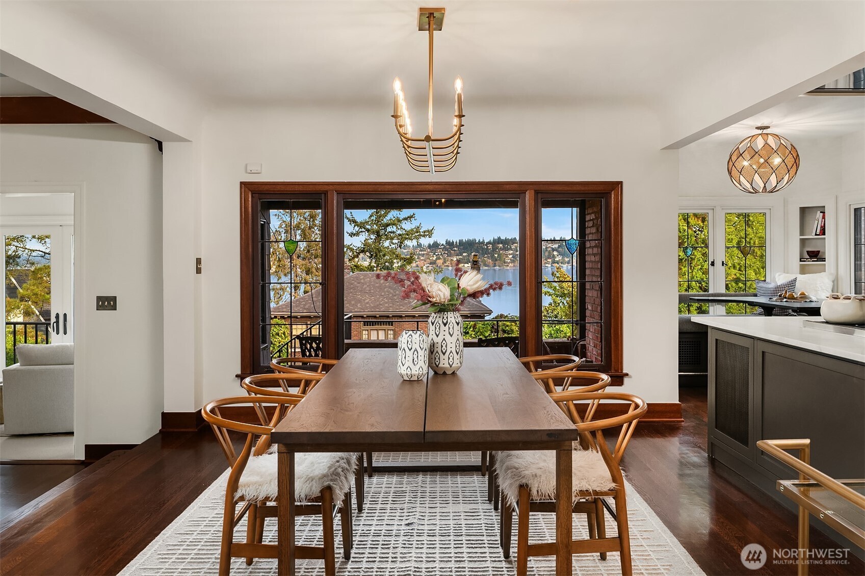 3220 Sierra Drive South Seattle, WA 98144 - Photo 5 of 39 a view of a dining room with furniture wooden floor and a chandelier
