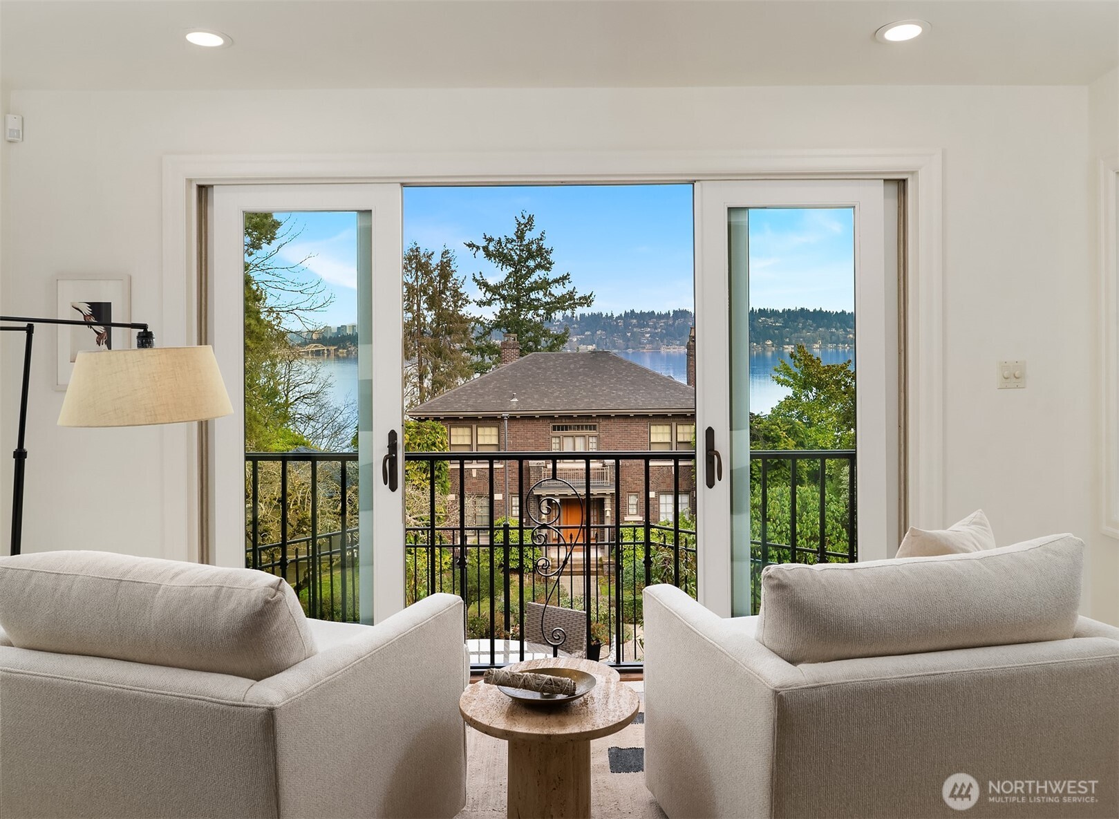 3220 Sierra Drive South Seattle, WA 98144 - Photo 8 of 39 a living room with furniture and a floor to ceiling window