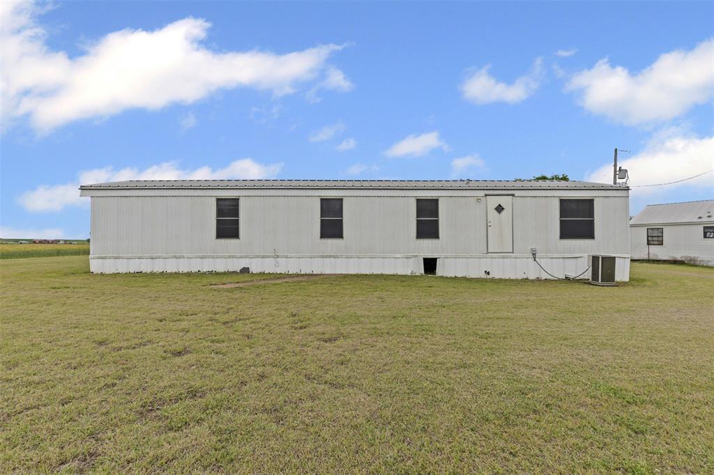 167 Hcr 4105 Covington, TX 76636 - Photo 12 of 32 Back of property featuring a lawn