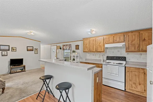 a kitchen with a stove and cabinets