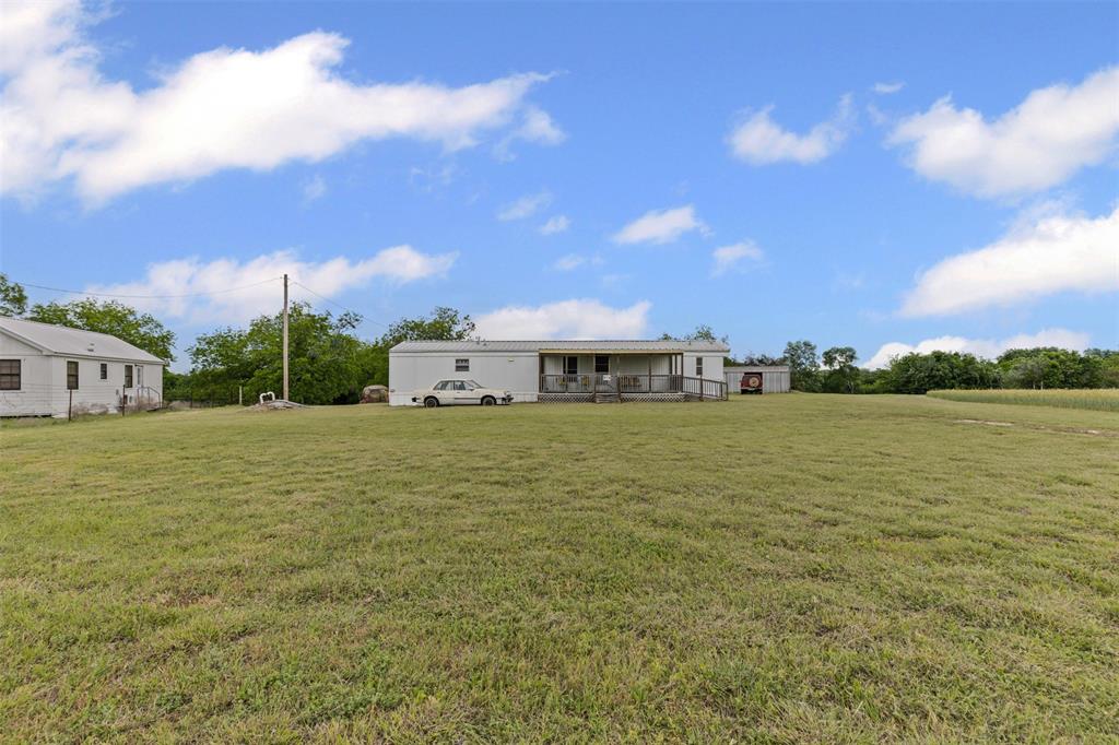 167 Hcr 4105 Covington, TX 76636 - Photo 9 of 32 View of green lawn
