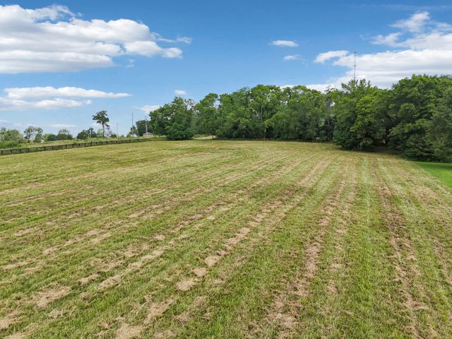 a view of a lake with a big yard