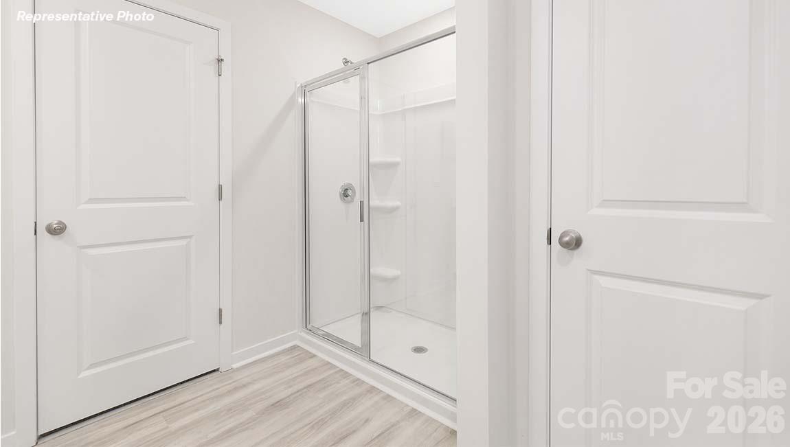 3265 Ora Smith Road Lincolnton, NC 28092 - Photo 13 of 21 a bathroom with a shower and a glass door