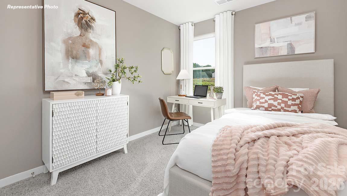 3265 Ora Smith Road Lincolnton, NC 28092 - Photo 16 of 21 a bedroom with a bed and a table in it