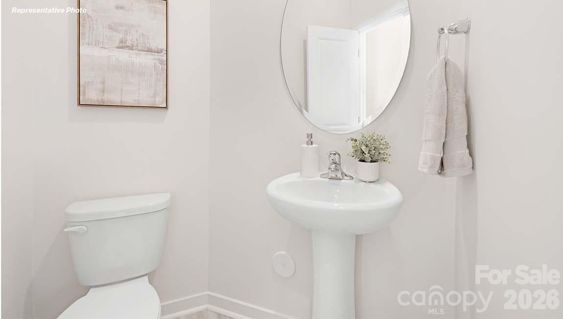 3265 Ora Smith Road Lincolnton, NC 28092 - Photo 20 of 21 a bathroom with a toilet sink and mirror