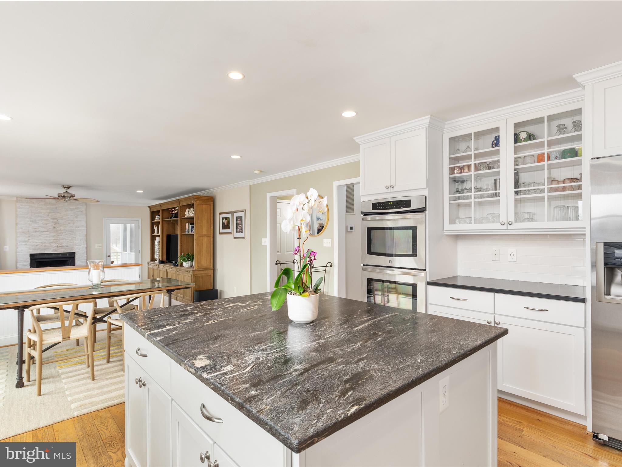 36823 Shoemaker School Road Purcellville, VA 20132 - Photo 14 of 59 a kitchen with stainless steel appliances granite countertop a sink a stove and a wooden cabinets