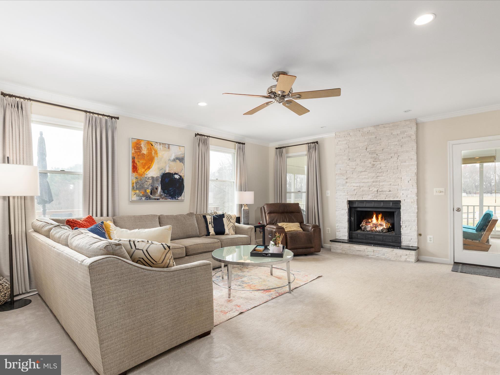 36823 Shoemaker School Road Purcellville, VA 20132 - Photo 16 of 59 a living room with furniture and a fireplace