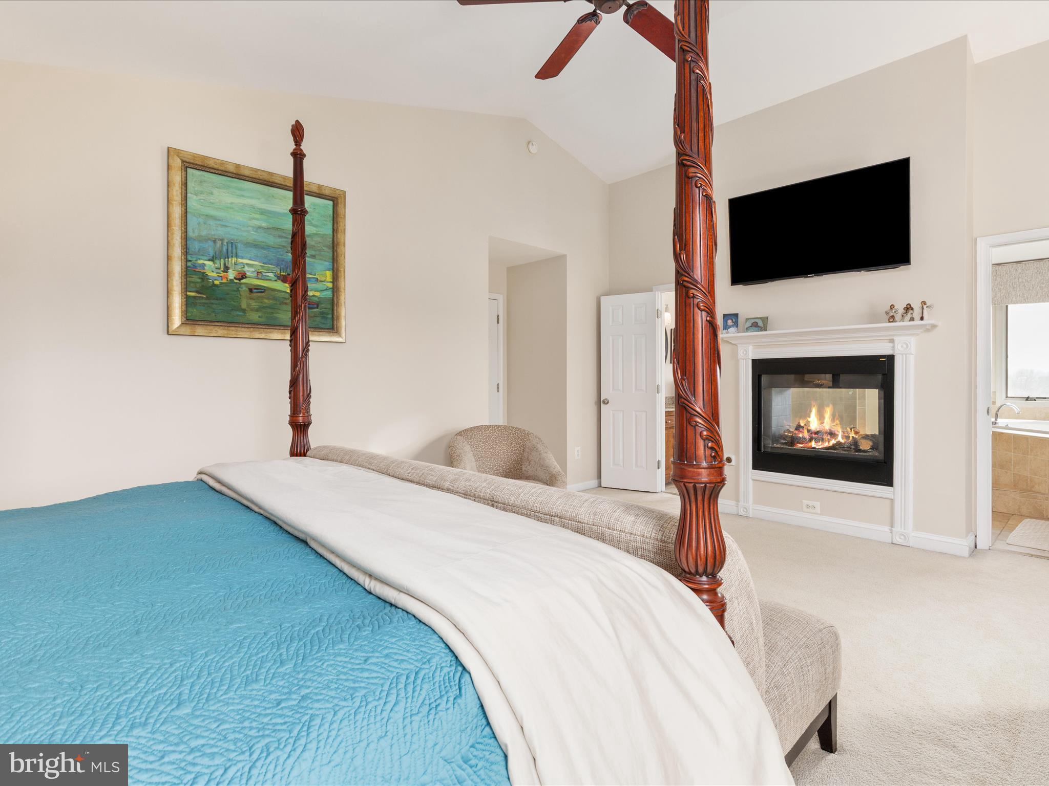 36823 Shoemaker School Road Purcellville, VA 20132 - Photo 20 of 59 a bedroom with a bed and a flat screen tv