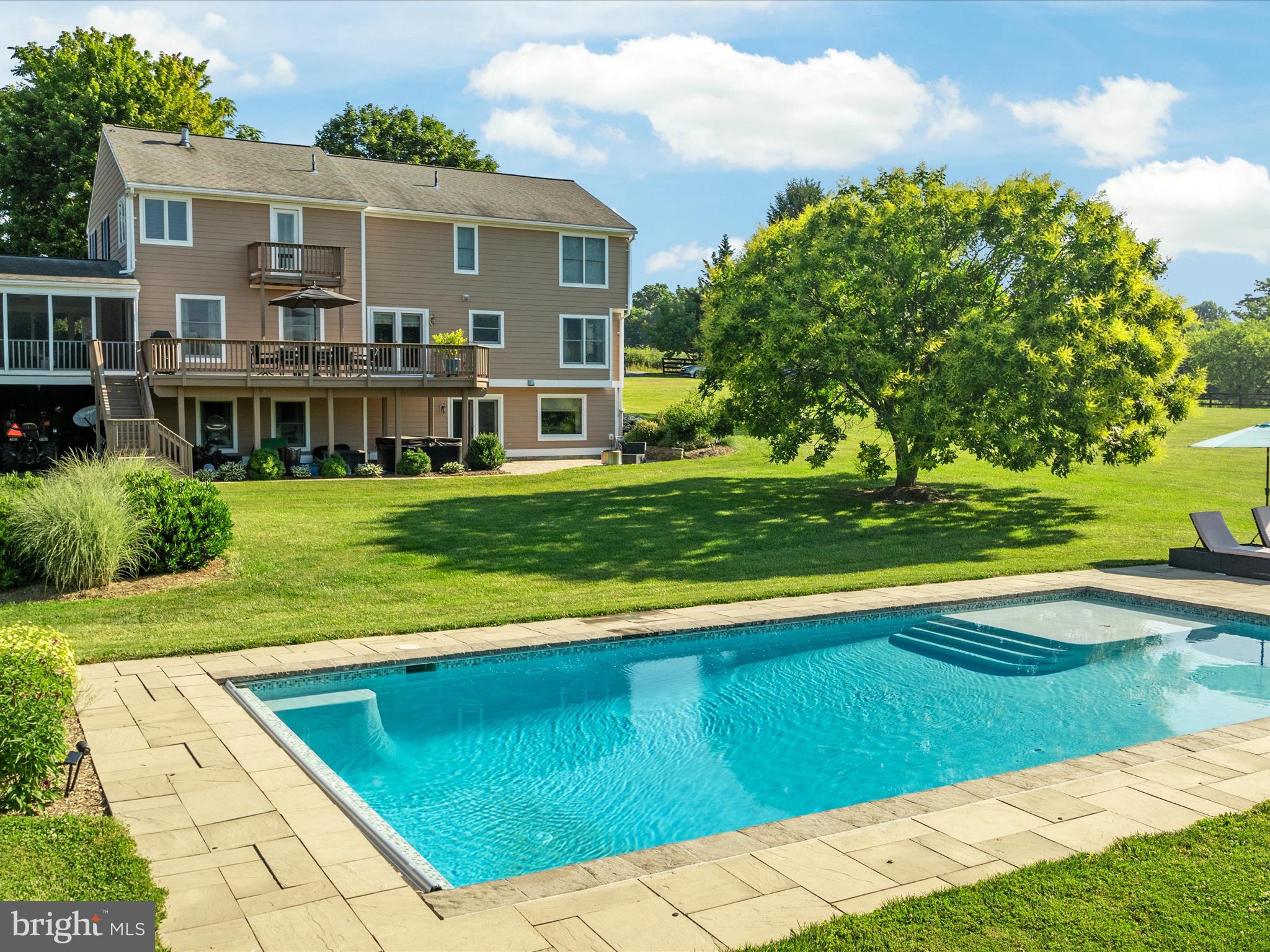 36823 Shoemaker School Road Purcellville, VA 20132 - Photo 3 of 59 a view of a house with a swimming pool