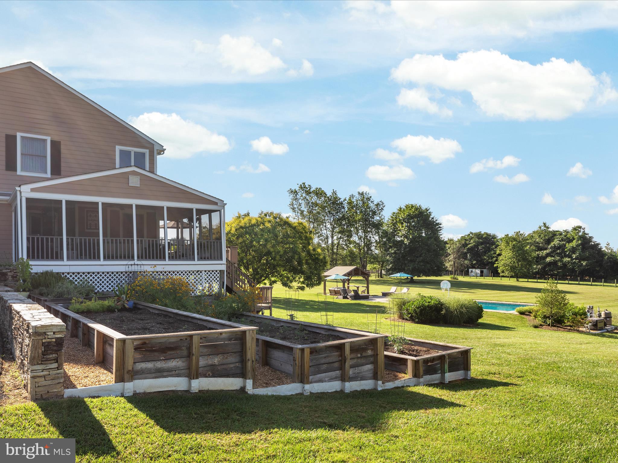 36823 Shoemaker School Road Purcellville, VA 20132 - Photo 39 of 59 a view of house with swimming pool and outdoor seating