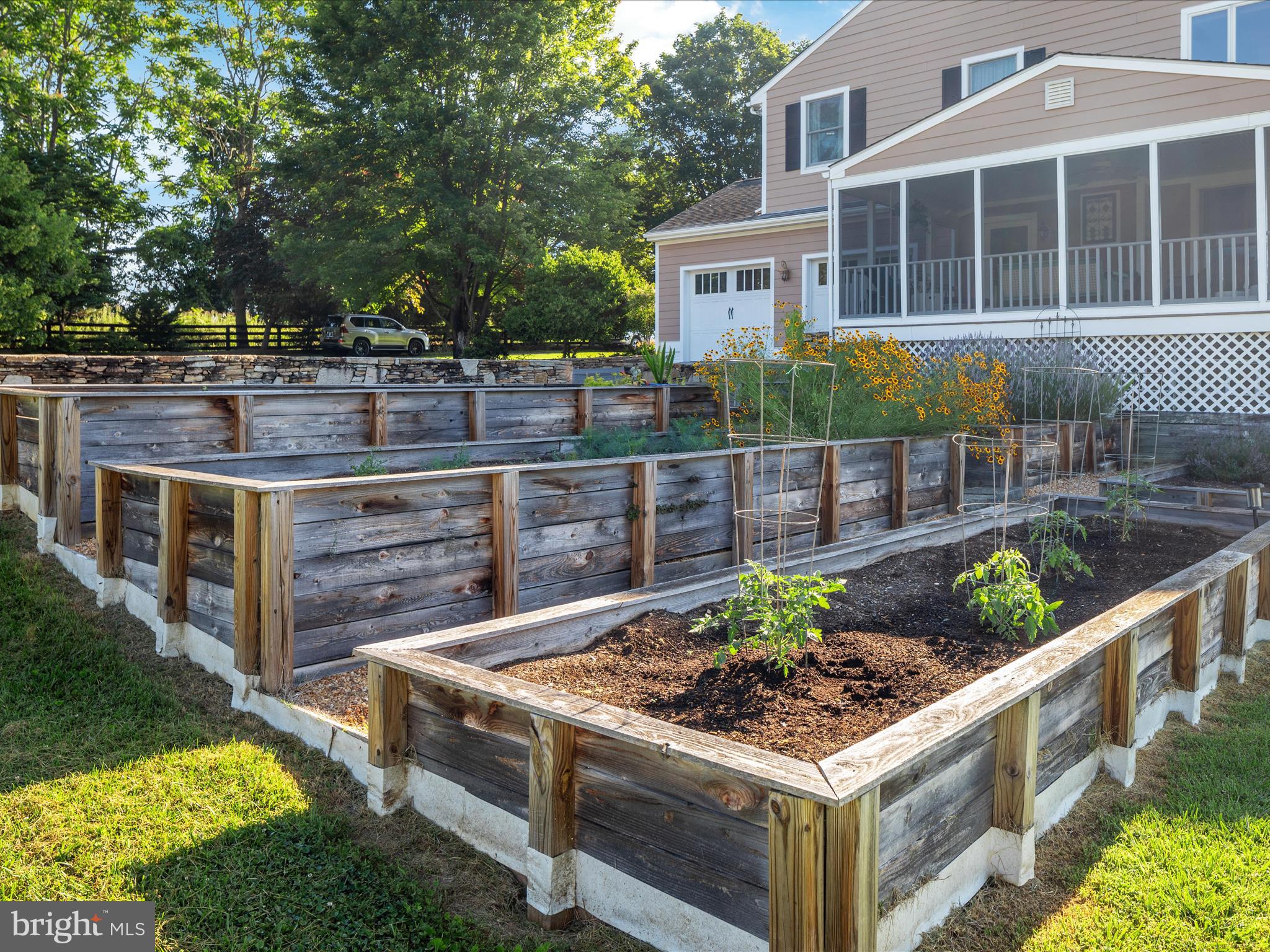 36823 Shoemaker School Road Purcellville, VA 20132 - Photo 40 of 59 a view of a chairs and table in the back yard of the house