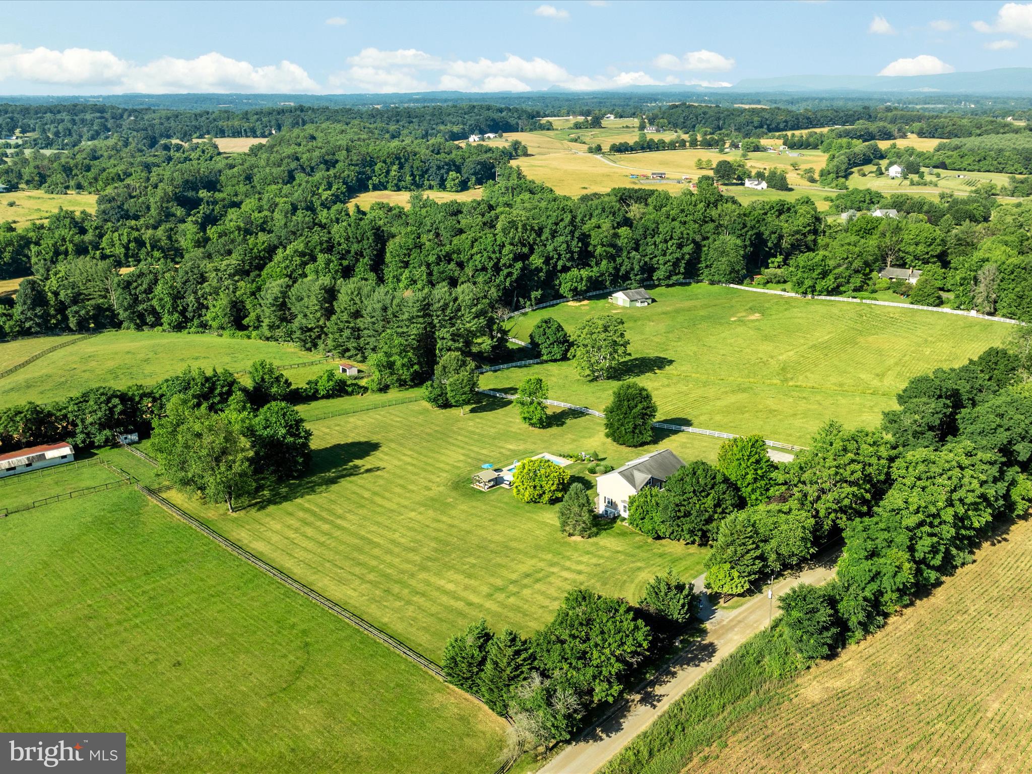 36823 Shoemaker School Road Purcellville, VA 20132 - Photo 42 of 59 a view of a lake with a big yard