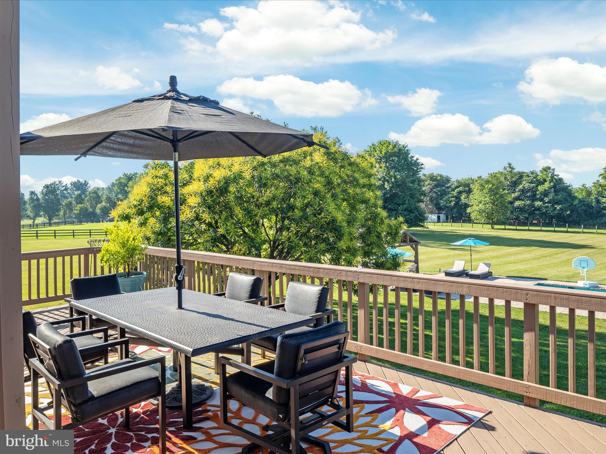 36823 Shoemaker School Road Purcellville, VA 20132 - Photo 44 of 59 a view of a balcony with furniture and a yard