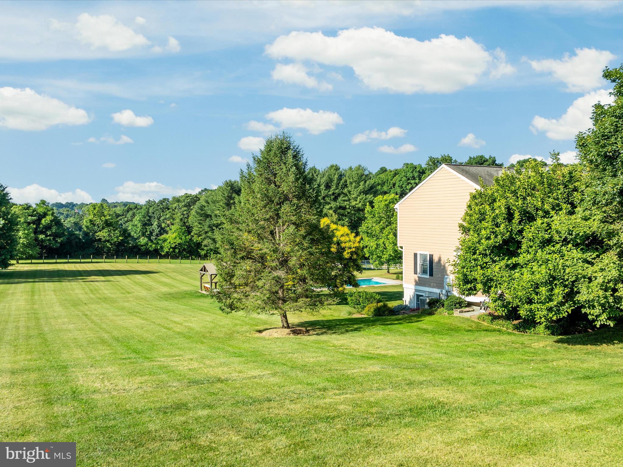 36823 Shoemaker School Road Purcellville, VA 20132 - Photo 51 of 59 a view of a house with a swimming pool