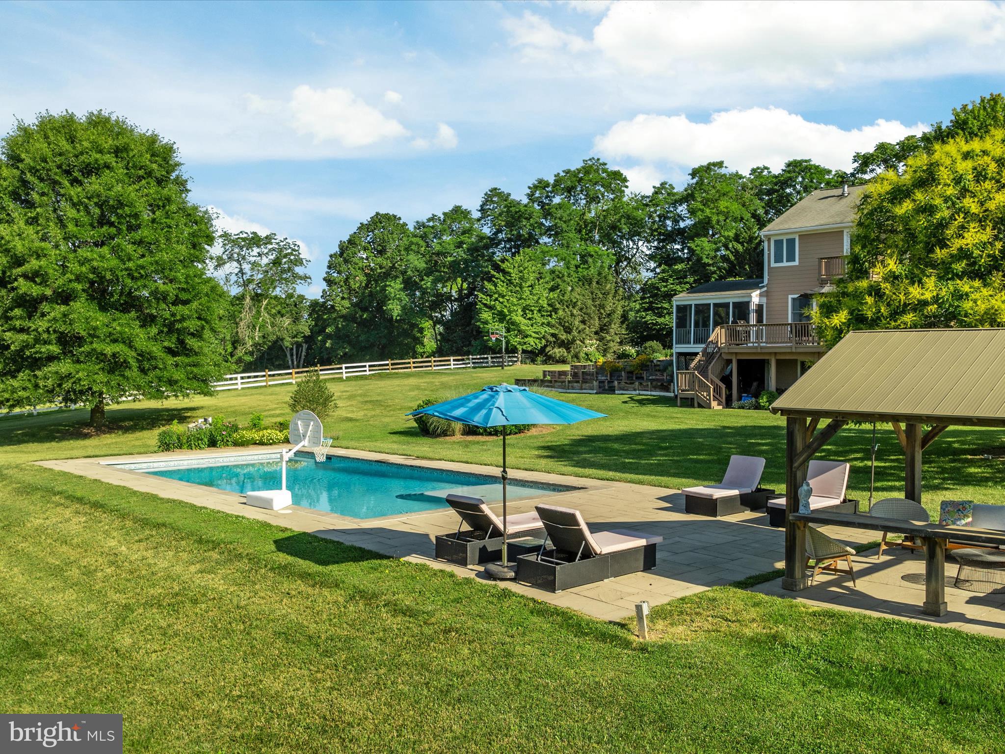 36823 Shoemaker School Road Purcellville, VA 20132 - Photo 55 of 59 a view of a swimming pool and lounge chairs in back yard