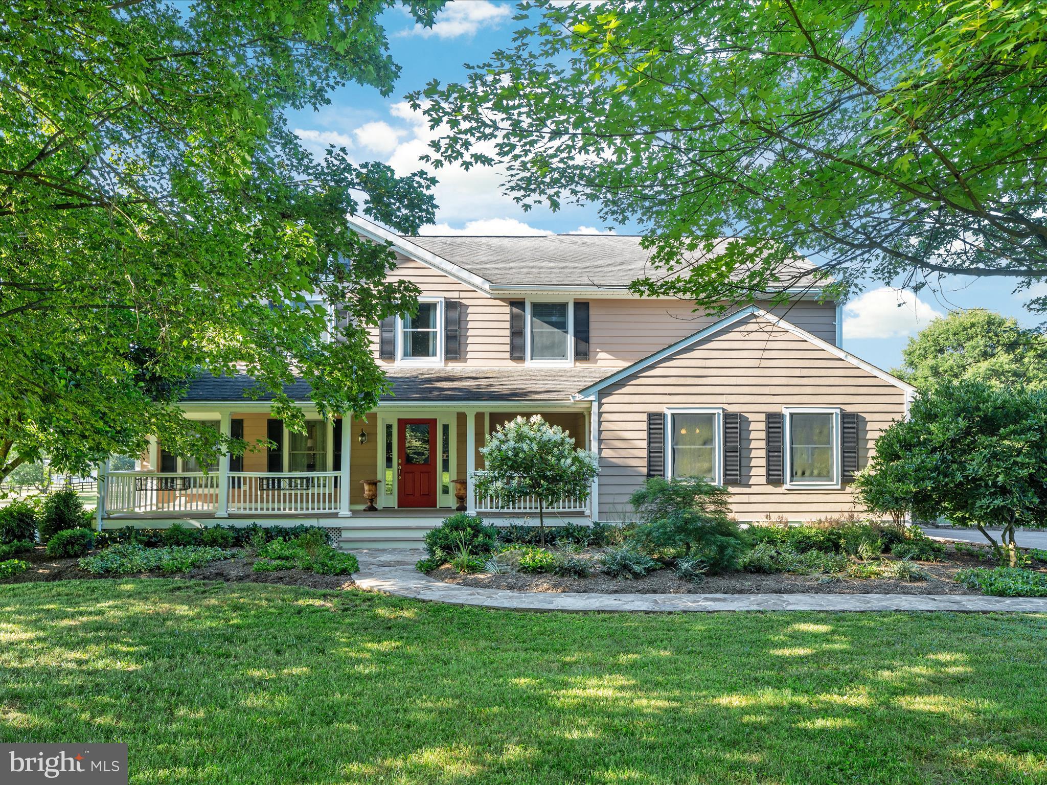 36823 Shoemaker School Road Purcellville, VA 20132 - Photo 58 of 59 a front view of a house with a yard and trees