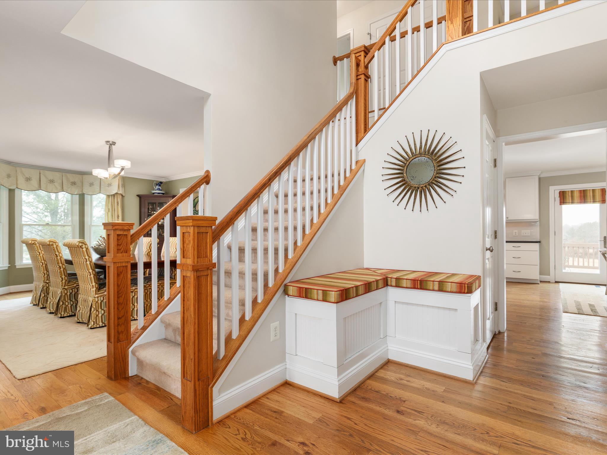 36823 Shoemaker School Road Purcellville, VA 20132 - Photo 7 of 59 a view of staircase with lots of frames on wall and wooden floor