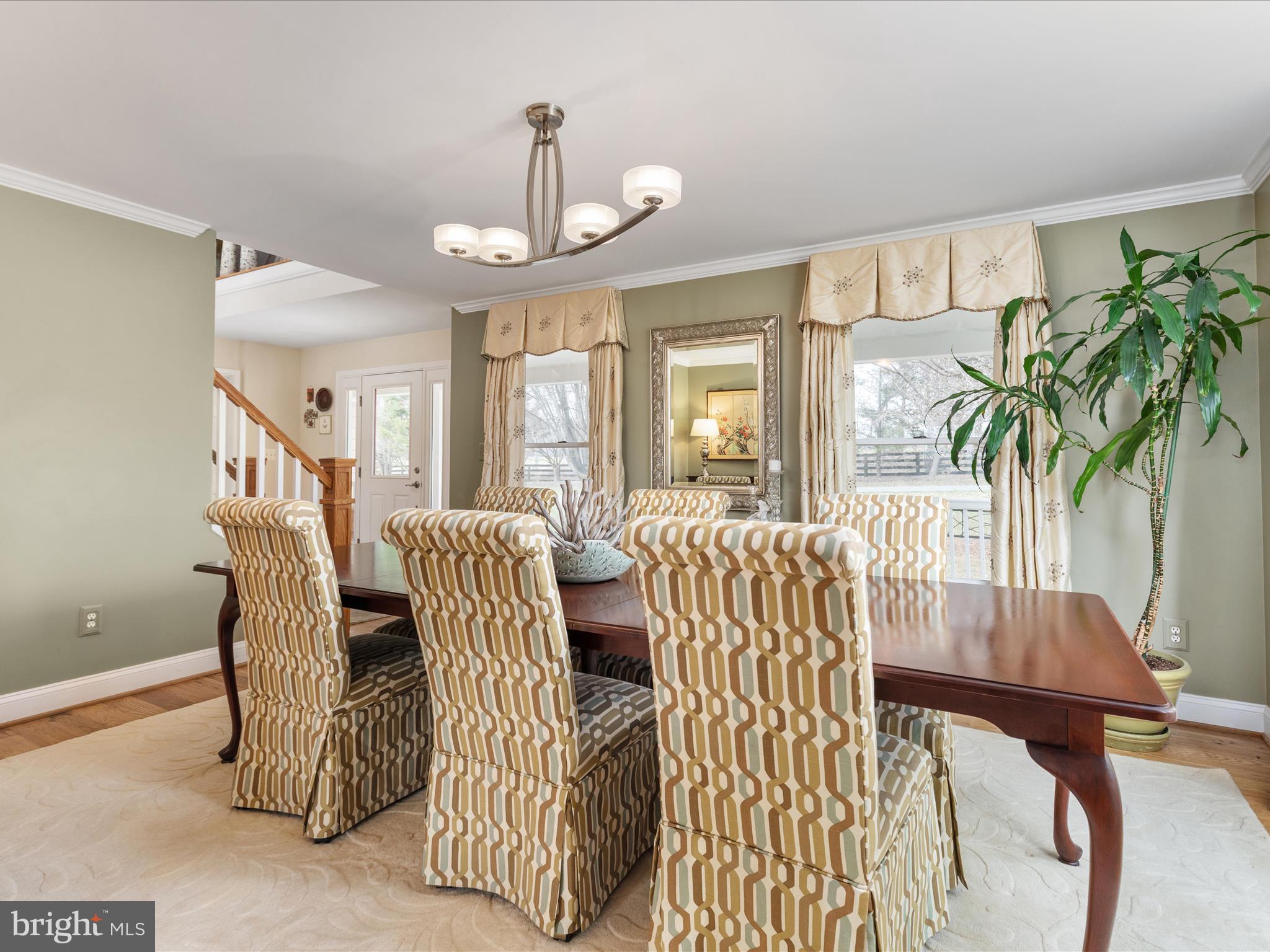 36823 Shoemaker School Road Purcellville, VA 20132 - Photo 10 of 59 a view of a livingroom and dining room with furniture wooden floor and a chandelier