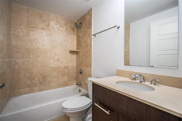 a bathroom with a toilet and a sink